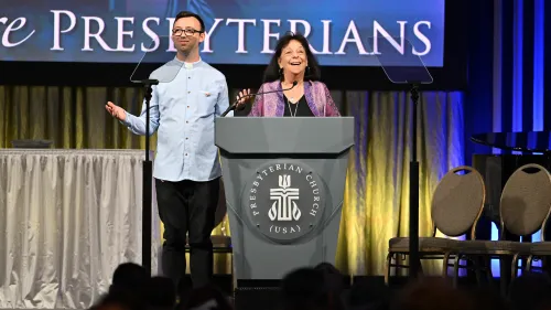 Brent Sheffer O'Neill (left) & Ruth Faith Santana-Grace (right) present the report of the General Assembly Relationships committee during the 10th plenary on July 1, 2026. Photo by Rich Copley.