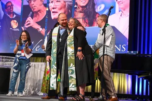 Rev. Dr. Kristopher D. Schondelmeyer (left) and Rev. Marta Pumroy-Cordero are installed as Co-Moderators of the 227th General Assembly during closing worship on July 2, 2026. Photo by Rich Copley