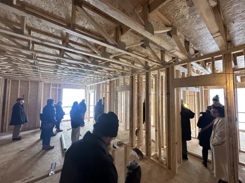 Members of Indianola Presbyterian Church tour new student housing the church developed on its property. 