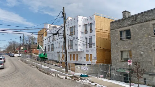 Members of Indianola Presbyterian Church tour new student housing the church developed on its property. 