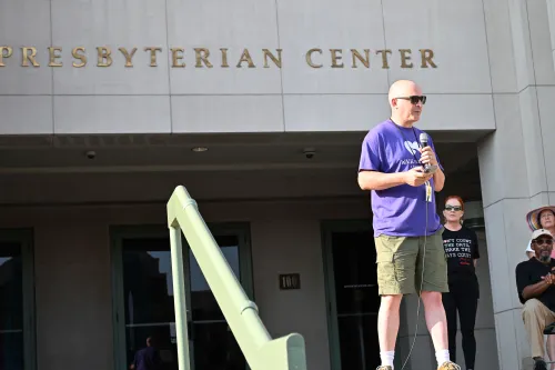 A Corp President Ian Hall speaks at peace walk