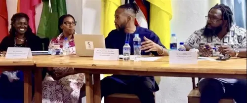 Ross-Allam meets presents on repair at the Liberian Council of Churches in 2023