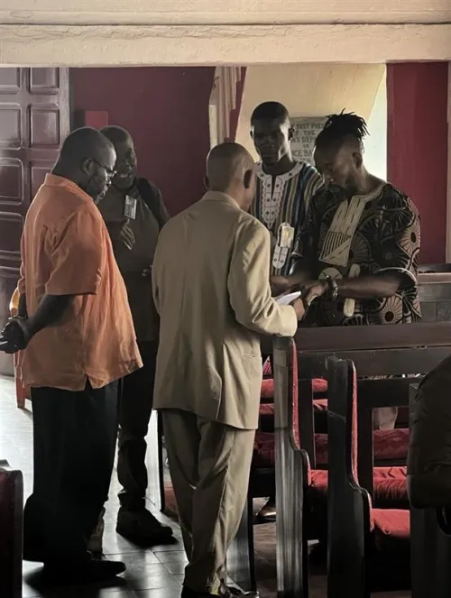 Dr. David Latimore of Princeton Theological Seminary and Ross Allam meet with elders at Providence Baptist Church in Monrovia in 2023.