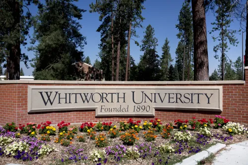 Outdoor sign with university name on it