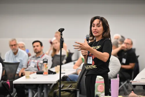 Dr. Cristal Silva-McCormick of Austin Presbyterian Theological Seminary asked a question after Robert O. Smith's keynote.