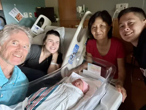 Andrew, MacKenzie, Haeja and Elias in the hospital with the new baby