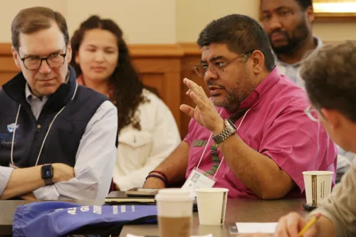 Rt. Rev. Silvestre Romero, rector of St. Patrick’s Episcopal Church in Broken Arrow, OK (in magenta shirt) and other attendees from four mainline denominations engage the practical and ethical issues surrounding AI in the church. 