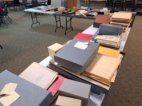 Unsorted records laid out on tables