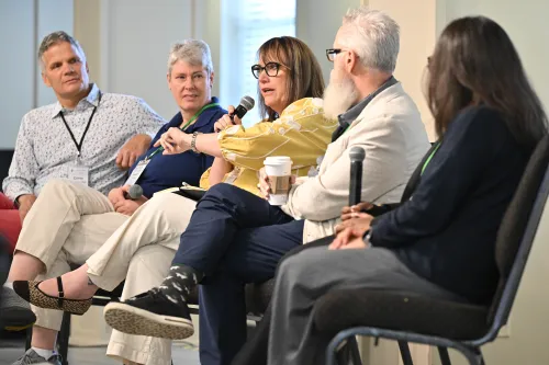 Corey Schlosser Hall moderates a panel of ecumenical denominational leaders at the 2026 AI Church Summit