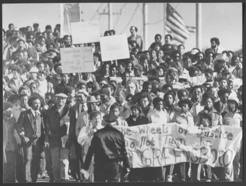 More than 500 marchers parade toward the Greensboro, N.C. courthouse on Nov. 20, 1980, protesting the recent acquittal of two Nazis and four Ku Klux Klansmen (KKK), accused of murder and rioting during an anti-Klan Communist rally last year