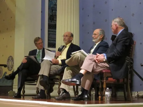 Four men in suits sit at the front of the Old Pine sanctuary in Philadelphia in October 2012 for a panel discussion of the film Not Much To do.