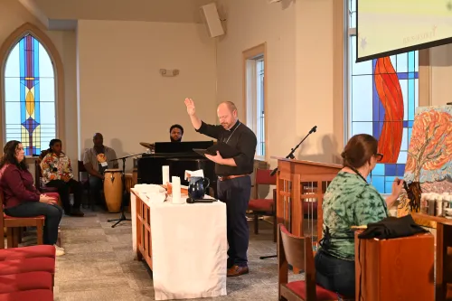 The Rev. Kris Schondelmeyer offers the benediction.