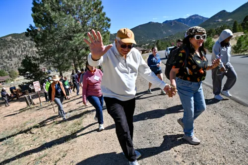 The Rev. Raafat Aboelfarag waves at the camera as he sets off on a 2.5 mile hike with other New Worshiping Communities leaders.