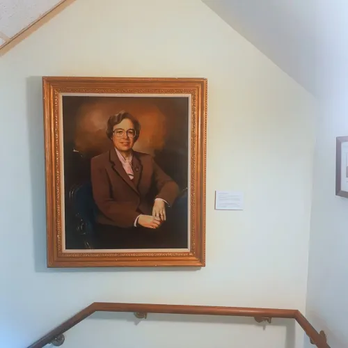 A painted portrait of Claire Randall hanging in the stairway leading from the 1st to the 2nd floor at the Presbyterian Historical Society.