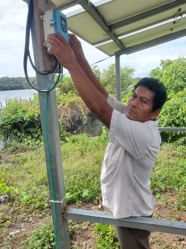 man working on solar water system