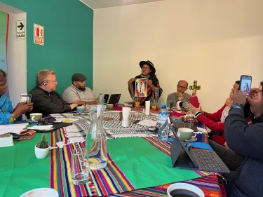 Milagros Samillan holds a picture for the PC(USA) delegation in Peru