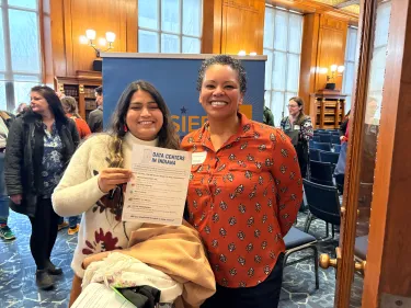 Jennifer Evans (right) attending a People's Hearing on data centers in Indianapolis, IN.