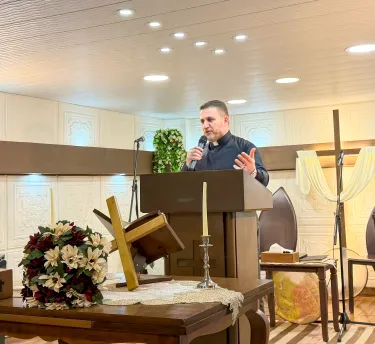 The Rev. Usama Alomar preaches during worship service at Good Shepherd Church. 