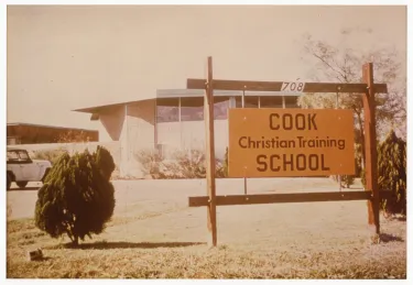 Shot of Cook Christian Training School campus building and sign.