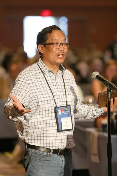 Sean Chow, Teaching Elder Commissioner, of San Diego Presbytery, speaks during the 8th plenary of the 227th General Assembly on June 30, 2026. Photo by Jim Deweese