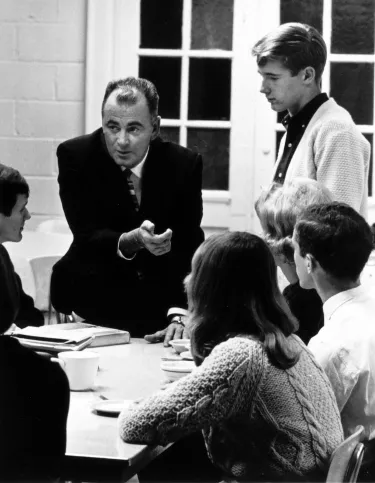 Church clergyman speaking with a table of youths about staying away from LSD, 1967.