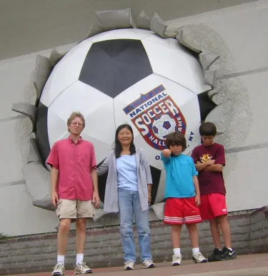 Andrew's family in 2006 standing in front of the Soccer Hall of Fame in Oneonta, NY