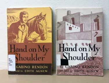 Two copies of Gabino Rendon's memoir Hand on My Shoulder, the left is the first printed version published in 1953, the right is the 1963 second edition.