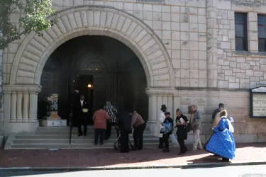 Audience members were encouraged to join the Mother Bethel community for refreshments and conversation after the ceremony concluded. This image shows people entering the sanctuary from the sidewalk.