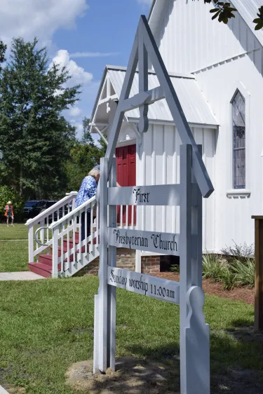 A church sign outdoors with First Presbyterian on it
