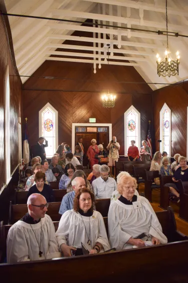 Inside of a church filled with people
