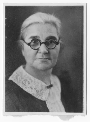 Black and white photograph of Tillie Tamaree in older years. Her hair is white, and she wears a pair of glasses with dark round frames.