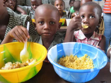 Children eating lunch at Hope Mission School, a rural primary and secondary school supported by Westminster Presbyterian Church of Albany, New York. The connection with this school started because of a Liberian-American who is a member of Westminster.