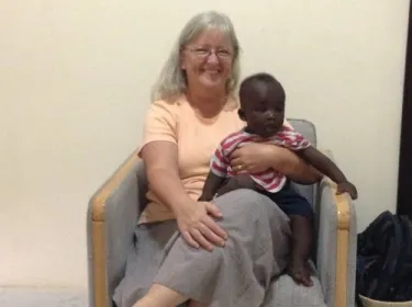 Sharon with the son of one of the housekeepers—getting "Grandma" time