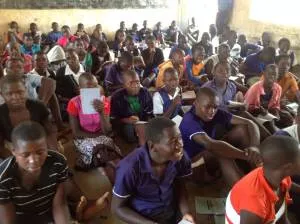 8th grade students sitting in their classroom just prior to the delivery of the benches