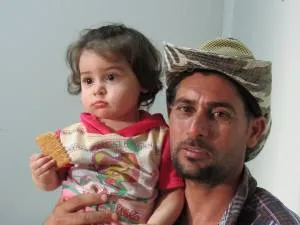 Father and daughter now living in an IDF (Internally Displaced Families) camp in Erbil, Iraq after ISIS forced them from their home in Mosul