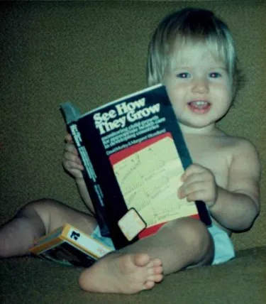 Lisa “reading” her father’s public health book 