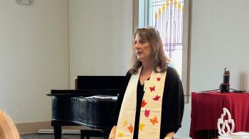 Rev. Gini Norris-Lane shows a stole with 22 butterflies representing the 22 lives lost in the Uvalde school shooting of 2022