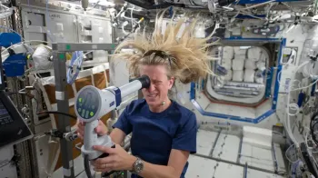 NASA astronaut Karen Nyberg uses a fundoscope to image her eye while in orbit (Photo by NASA).