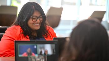 Stephanie Vasquez works with contractors who provided live interpretation for the online committee meetings at GA227. Photo by Rich Copley.