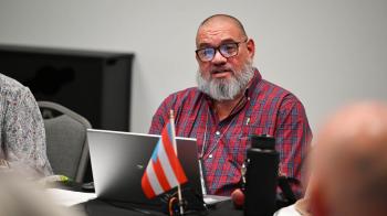 Unification Commission member José Rosa-Rivera shares a message from presbytery &amp; synod leaders in Puerto Rico at the commission's final meeting. Photo by Rich Copley.