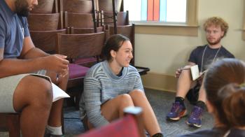 Allie Cardoza chats with her small group about being a leader “speaking something of God to the people.”
