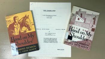 Two copies of a book titled Hand on My Shoulder, placed on each side of a document.