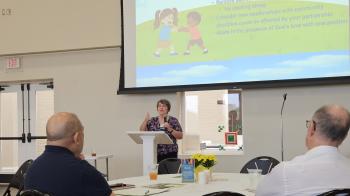 Rev. Sharan Knoell speaks at POAMN by Kelley Hope