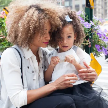 woman holding small child