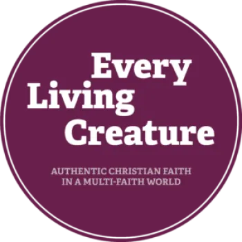 Every Living Creature-round maroon circle with white lettering