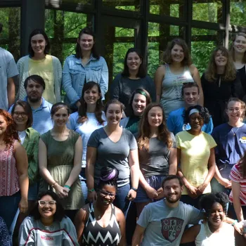 Large group of young adults posing for photo