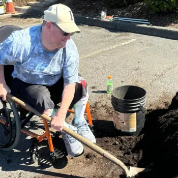 member working with garden dirt