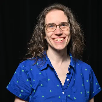 Katie Snyder in a button down blue top. 