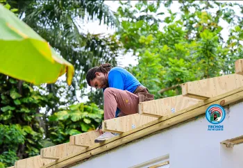 volunteer working on roof