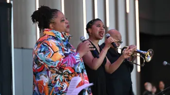 Rev. Dr. Eustacia Moffett Marshall and Jessica Moffett Lee, Diane Moffett's daughters, perform a spiritual song. Photo by Rich Copley.